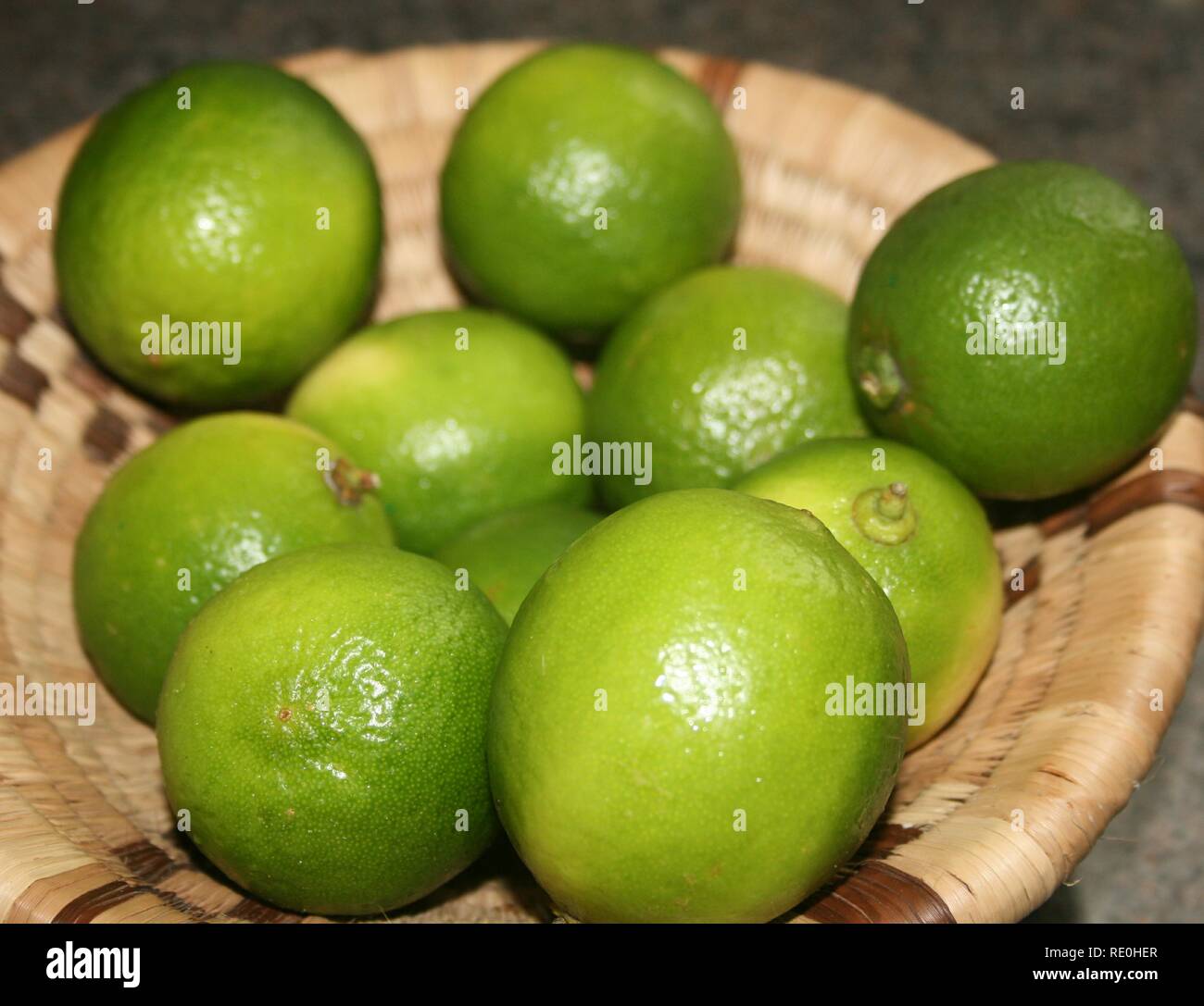 A basketful of Limes Stock Photo