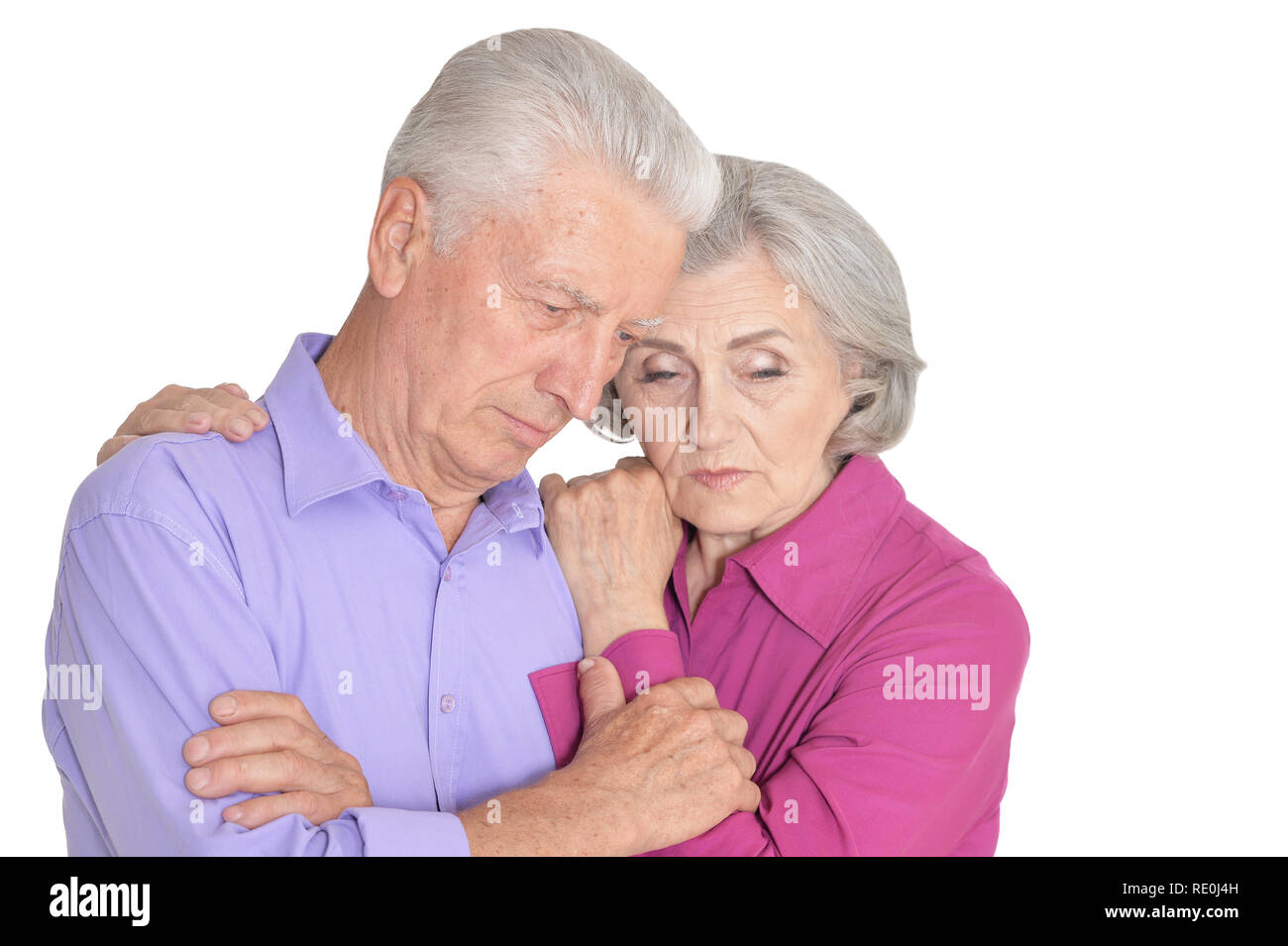 Portrait of sad senior couple isolated on white background Stock Photo