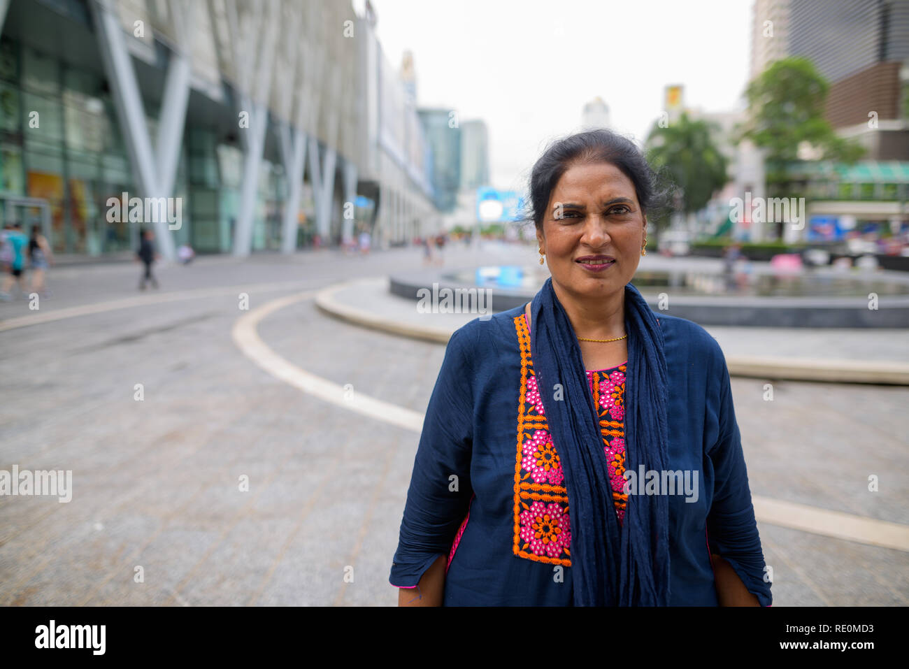 Mature beautiful Indian woman exploring the city of Bangkok, Tha Stock Photo
