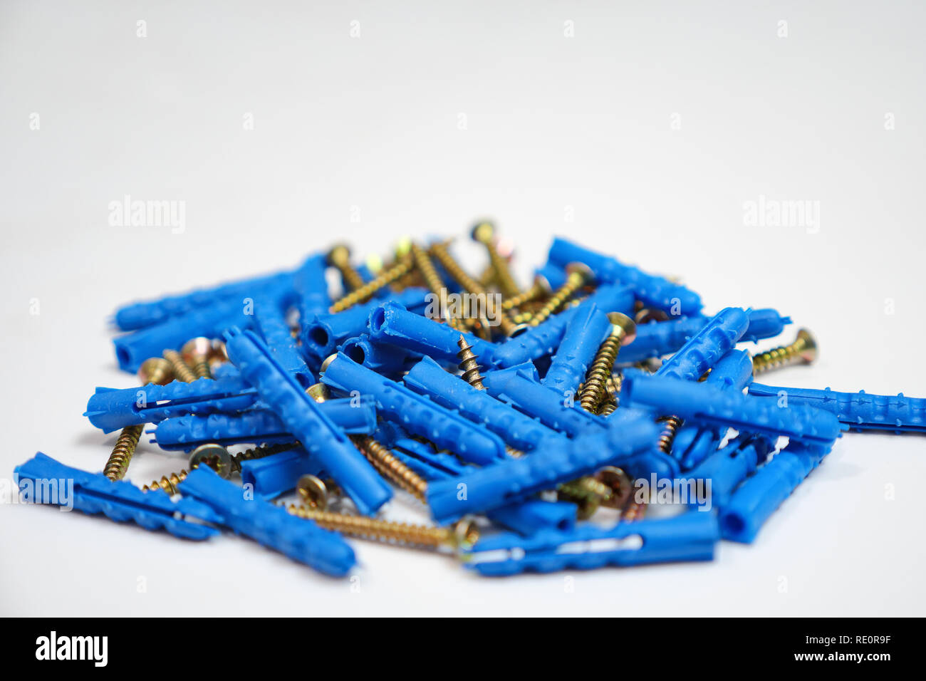 Plastic dowel pin or wall plugs on white background. Stock Photo