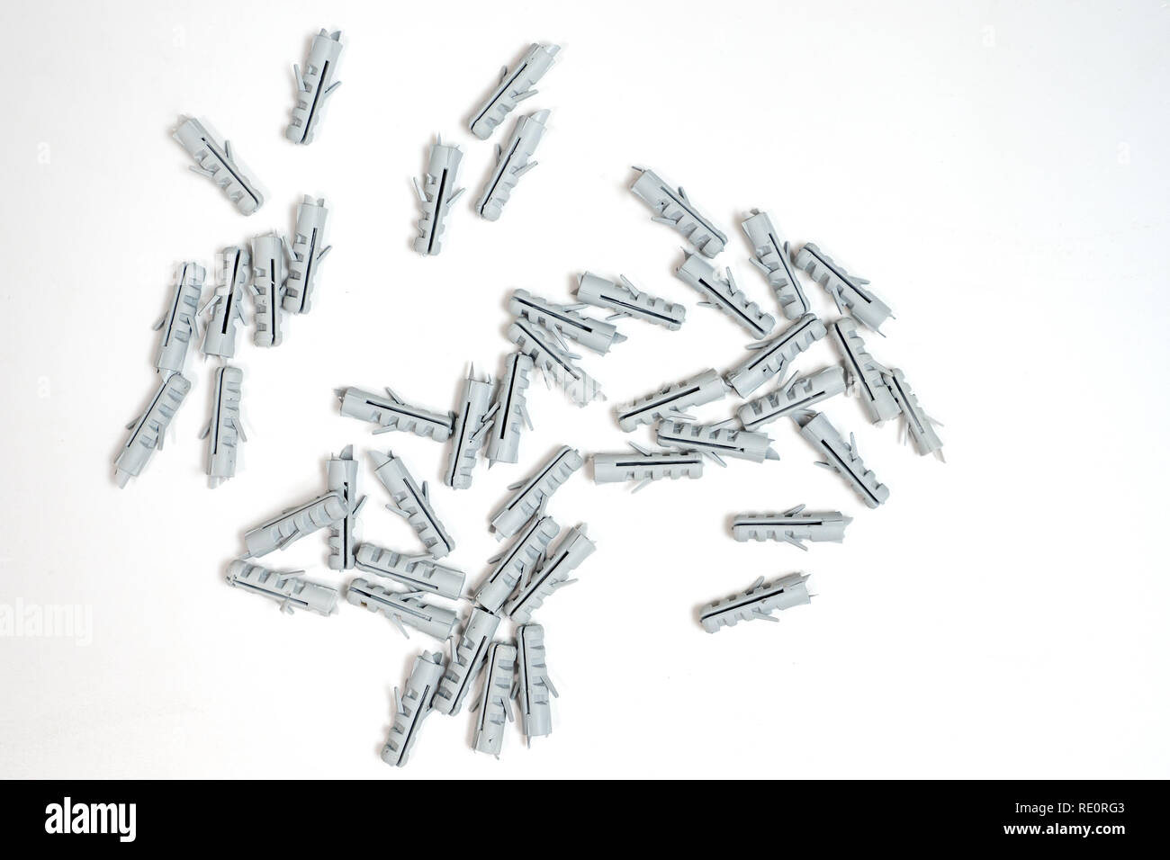 Plastic dowel pin or wall plugs on white background Stock Photo - Alamy