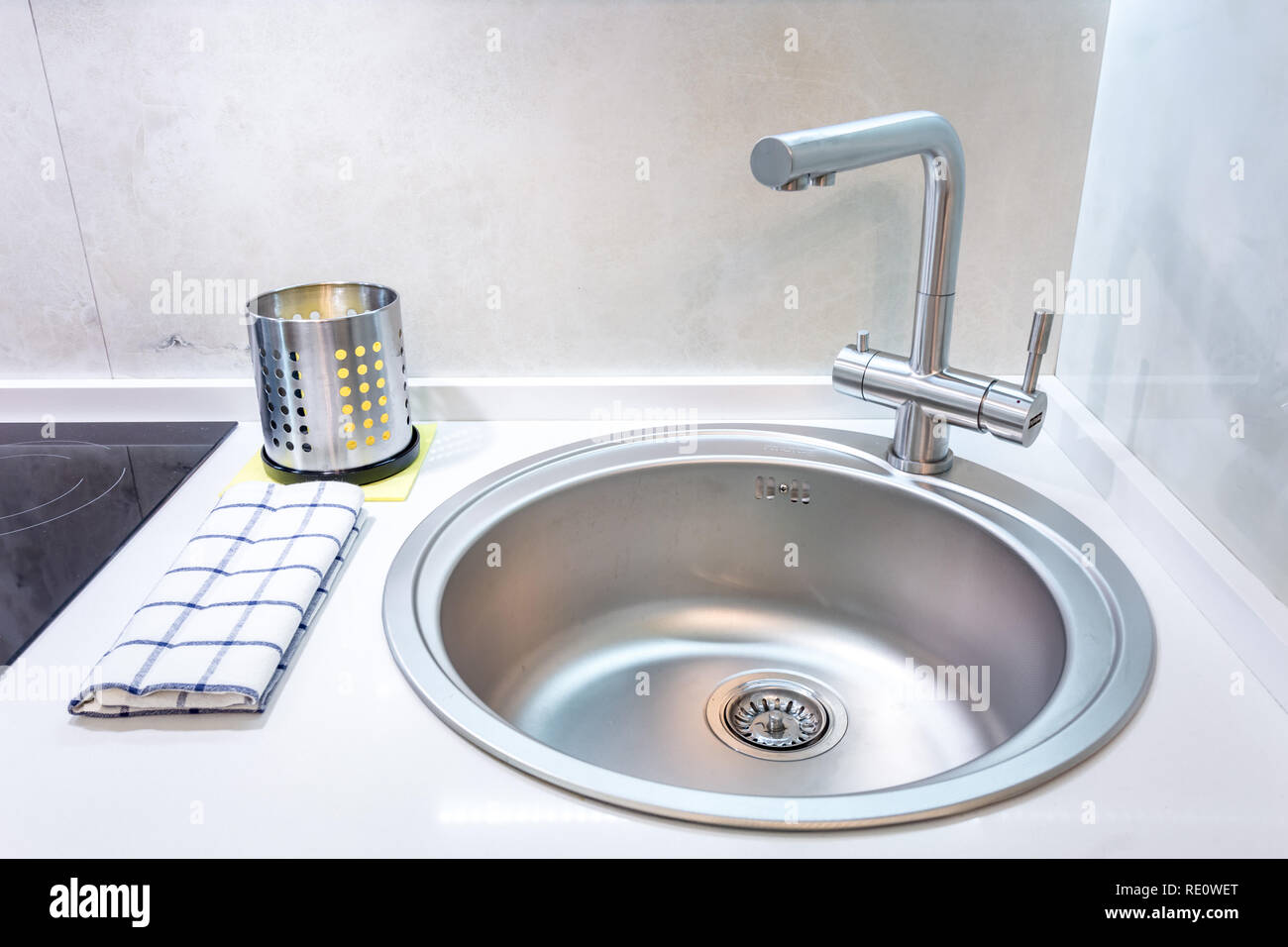 Water Tap Sink With Faucet In Expensive Loft Kitchen Stock Photo