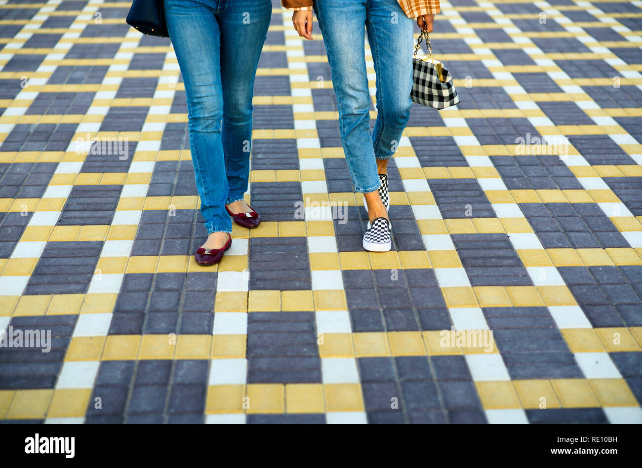 Two girls walking together hi-res stock photography and images - Alamy
