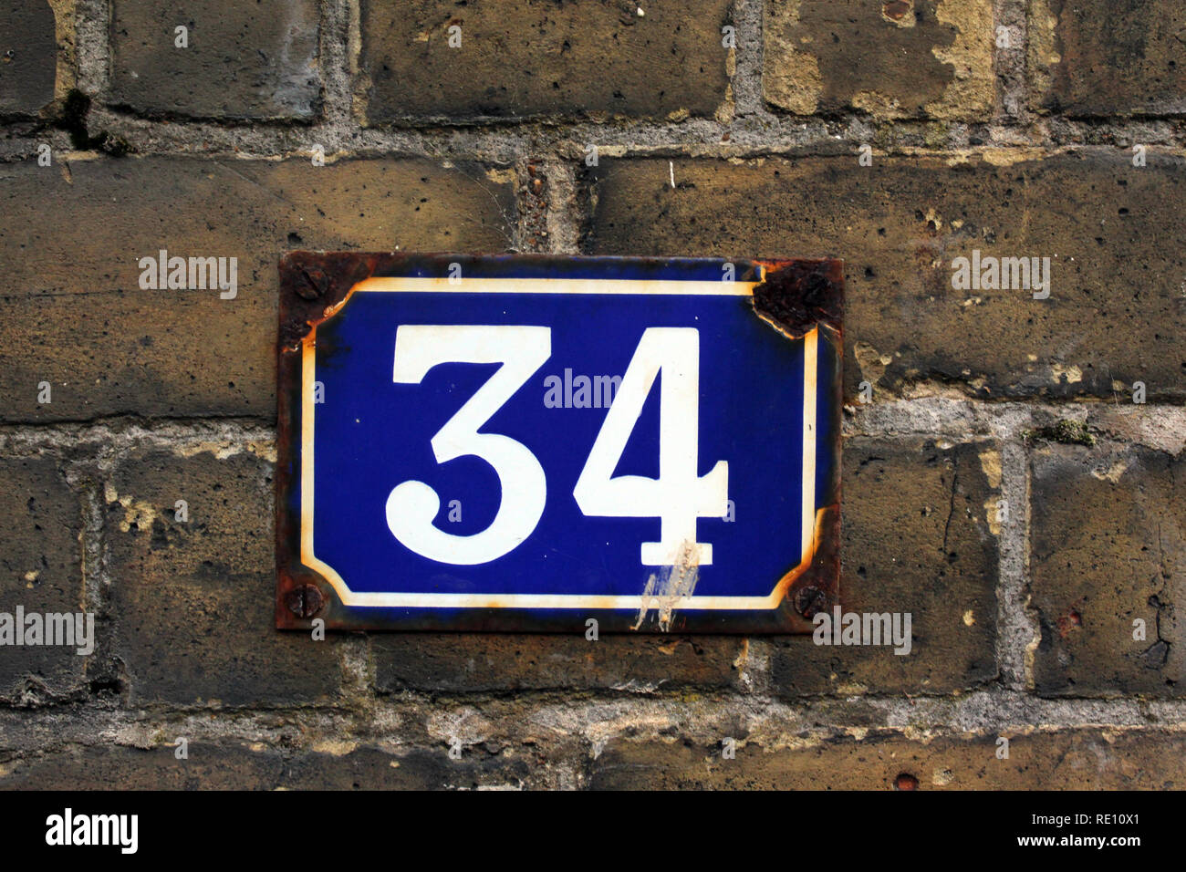 Number 34 street sign plaque, England, UK Stock Photo
