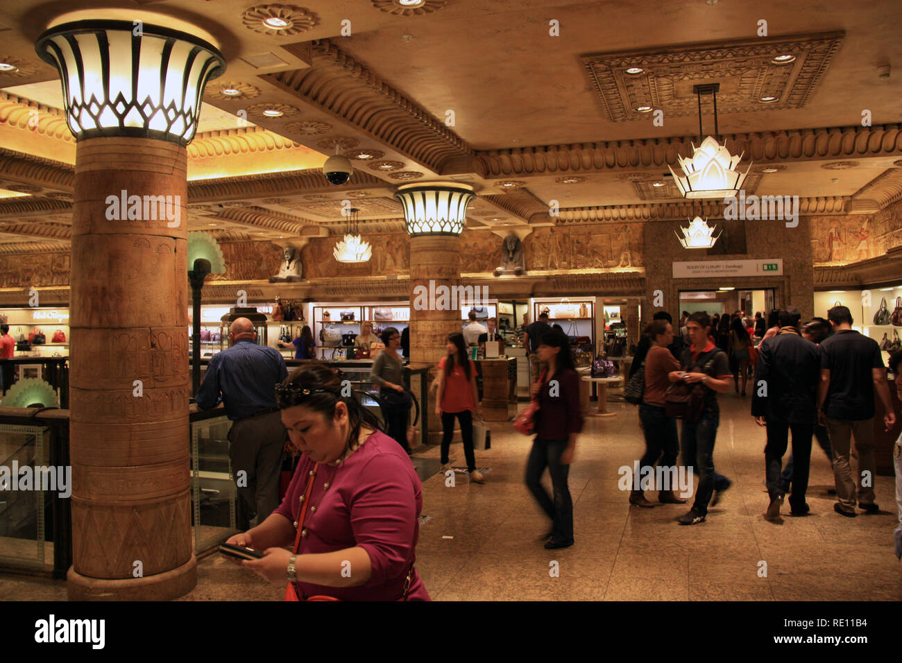 https://c8.alamy.com/comp/RE11B4/customers-and-tourists-walking-through-the-ancient-egypt-themed-clothing-department-at-harrods-london-united-kingdom-RE11B4.jpg