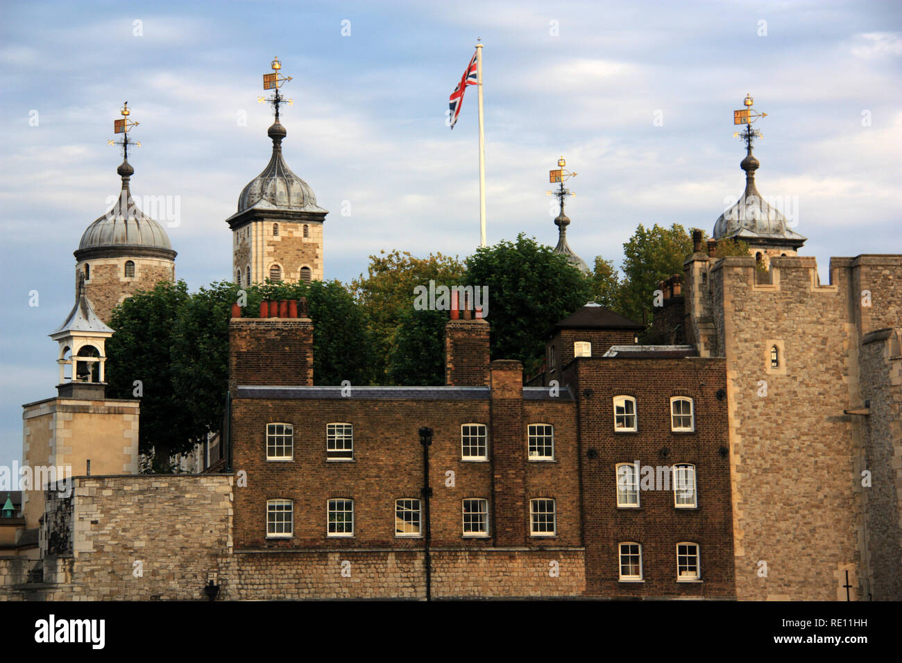 Union Jack waving on a flagpole at Her Majesty's Royal Palace and Fortress of the Tower of London, United Kingdom Stock Photo