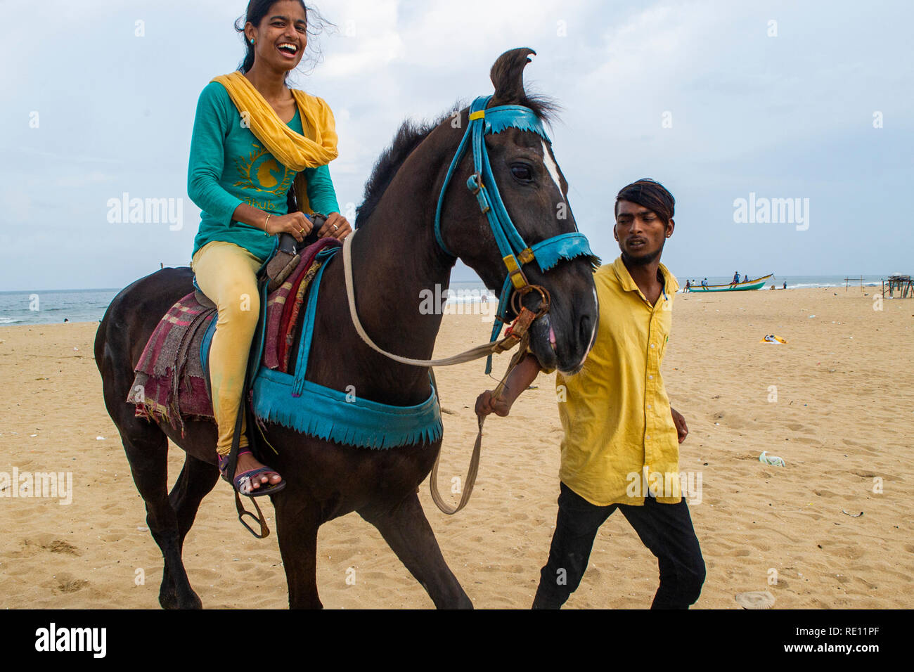 Horse riding on Marina Beach, near Chennai city centre Stock Photo