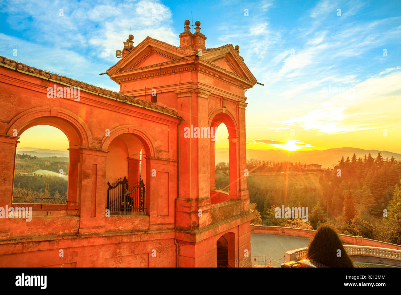 Aerial view from Sanctuary of Blessed Virgin of San Luca, of Colle della Guardia above city of Bologna. Spectacular sunset light. Famous landmark cityscape in Emilia-Romagna, Italy. Stock Photo