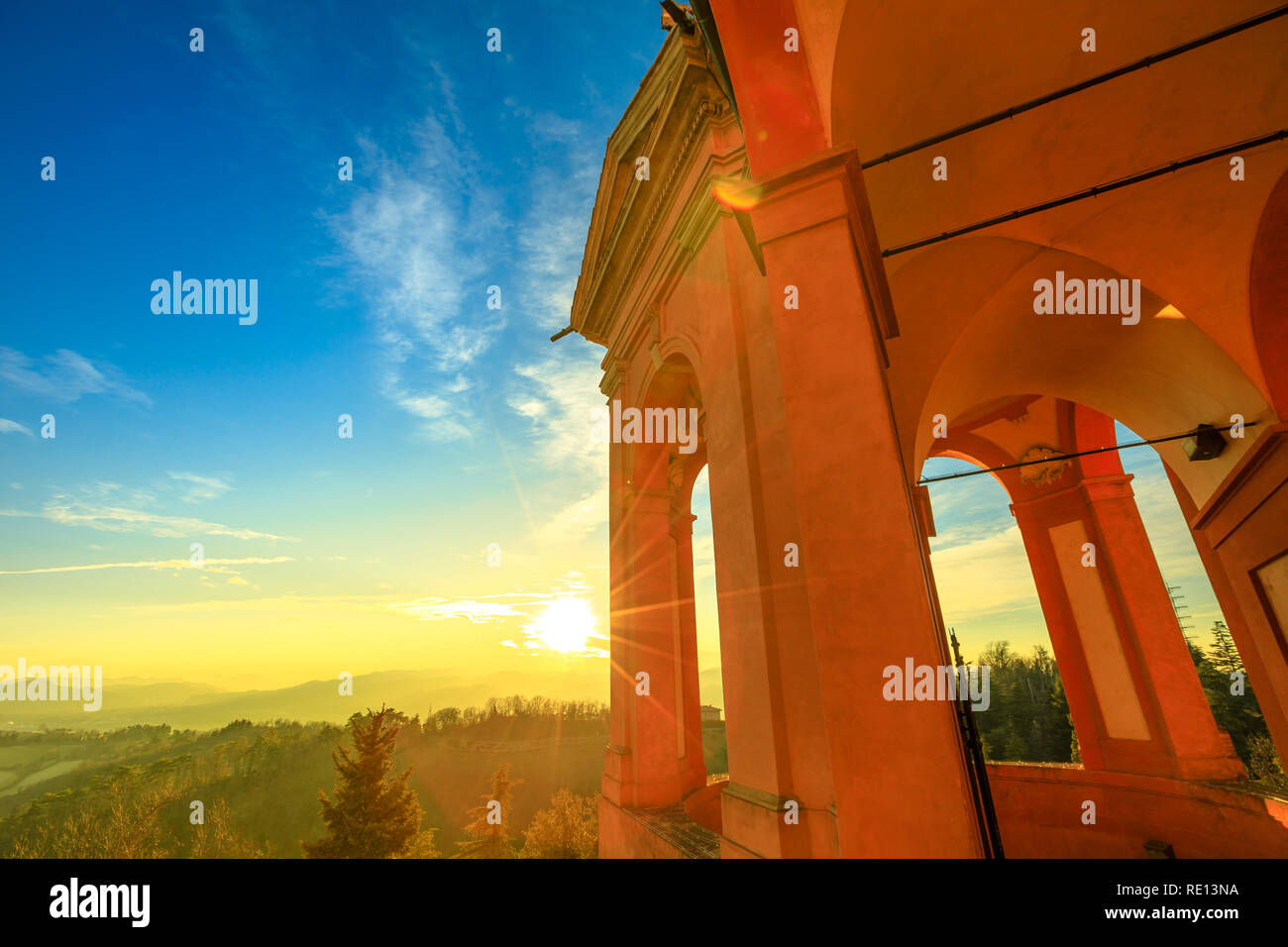 Arches of Sanctuary of Blessed Virgin of St. Luke on Colle della Guardia. Spectacular landscape of Bologna hills at sunset light. Famous pilgrimage destination in Emilia-Romagna, Italy, Europe. Stock Photo