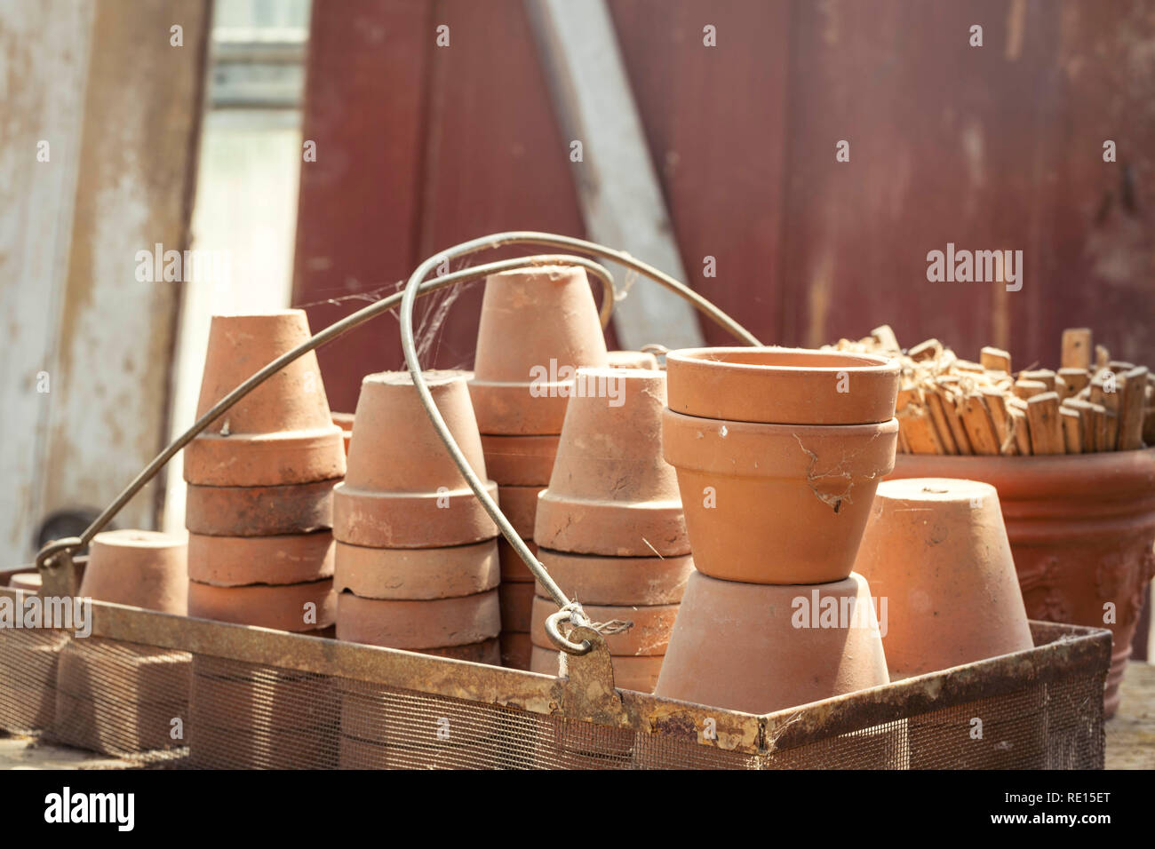 Terracotta pots stacked up outside Stock Photo