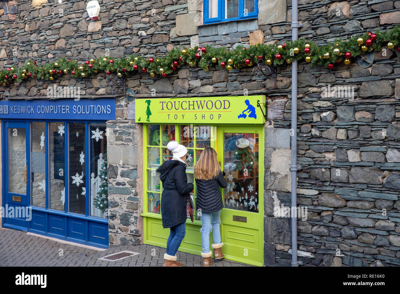 Mother and daughter enter Touchwood toy shop selling wooden toys in