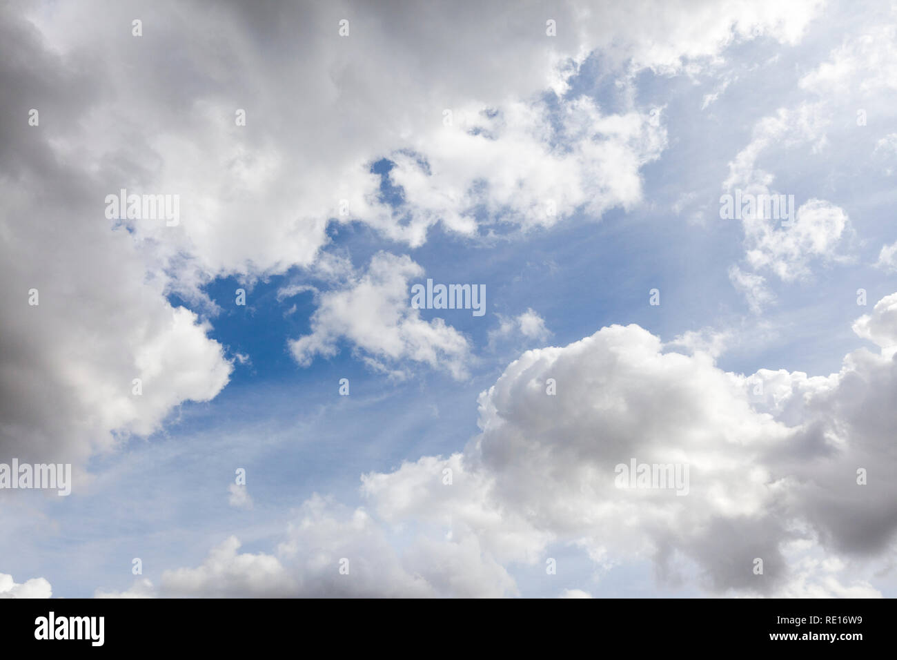 White summer clouds in a blue sky background Stock Photo - Alamy