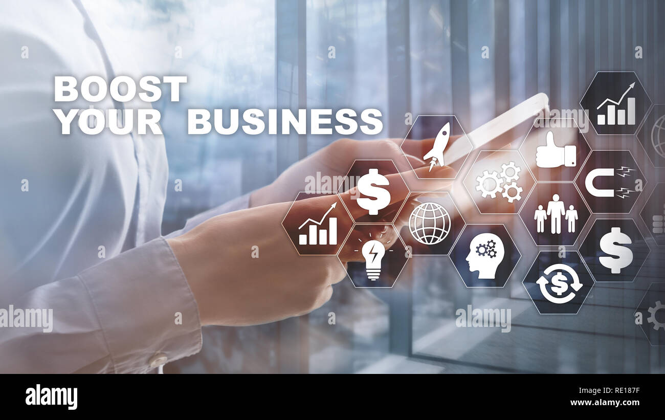 Financial and Technology concept. On a virtual screen inscription: Boost Your Business Stock Photo