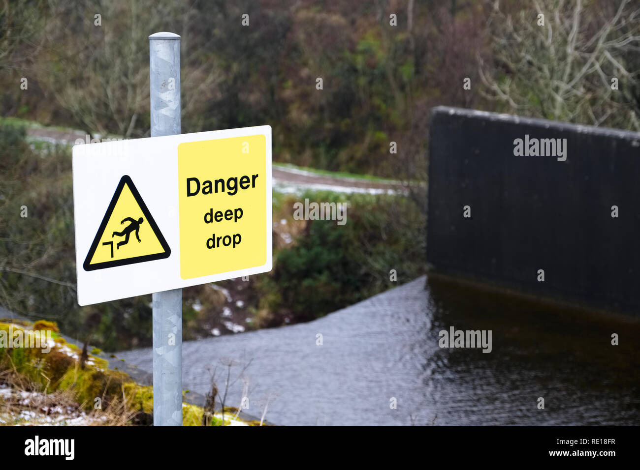 Steep deep drop danger warning sign waterfall Stock Photo