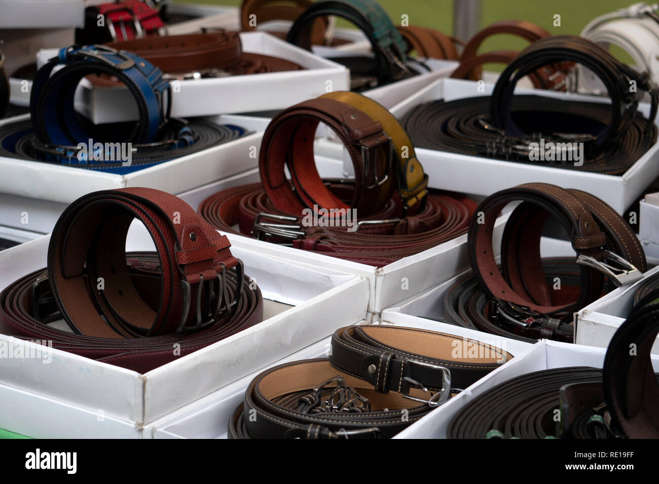 many different colors leather belt on display at the market for sale ...