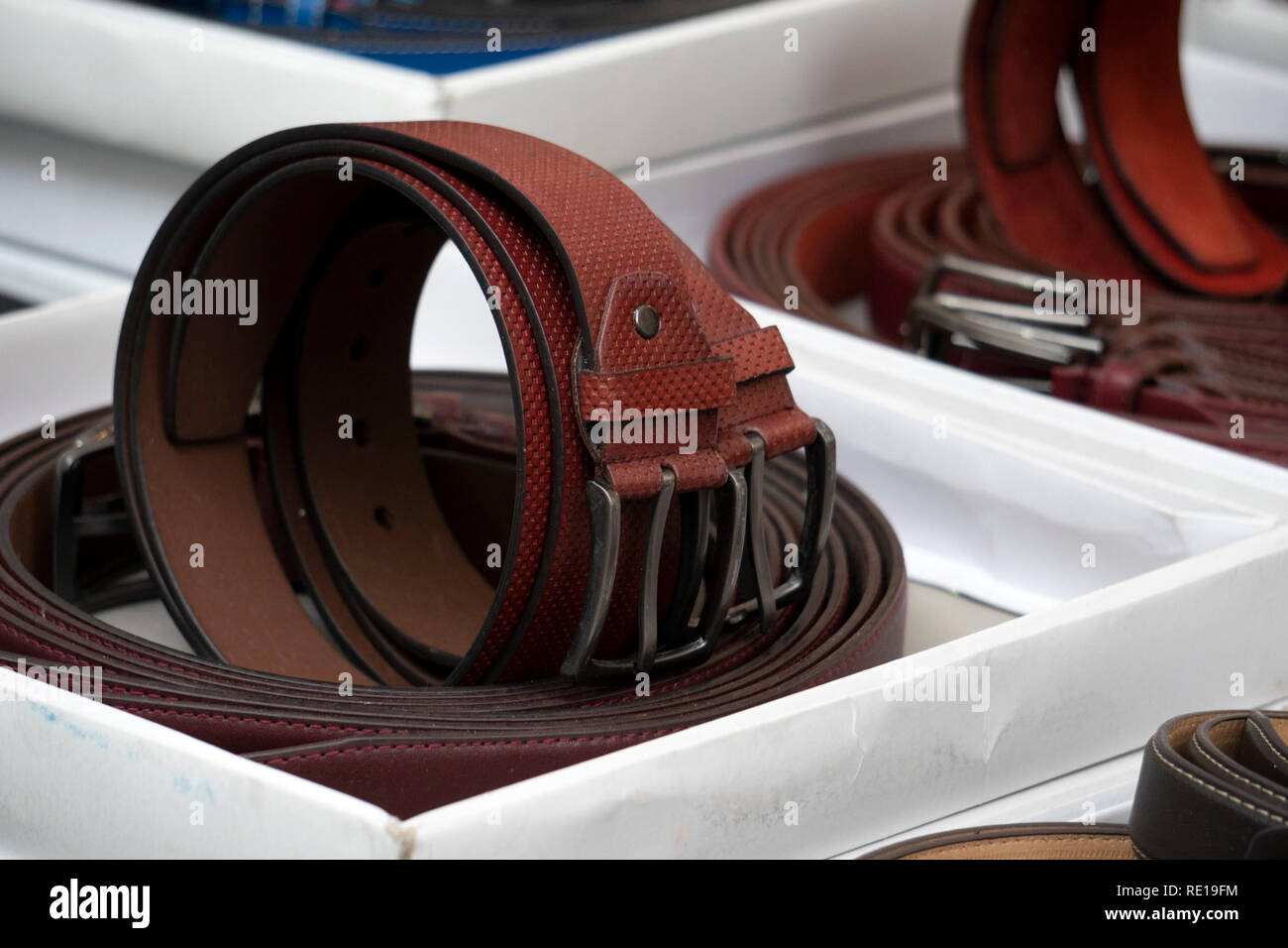 many different colors leather belt on display at the market for sale ...