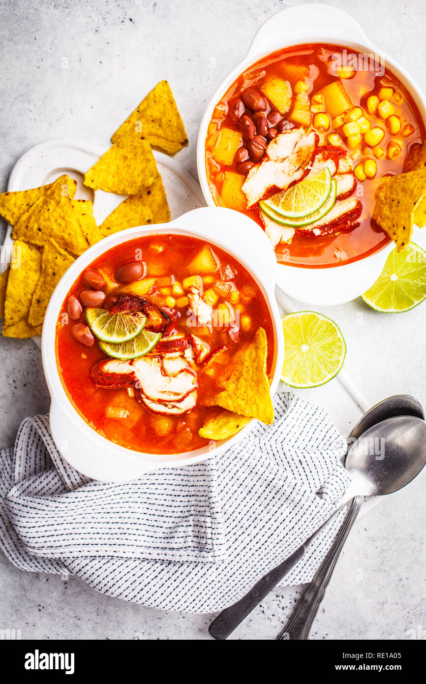 Mexican Soup With Beans Chicken Corn And Nachos In White Bowls Top View Chili Con Carne Traditional Mexican Food Stock Photo Alamy