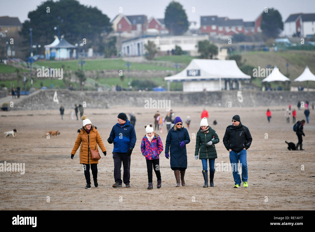 People take a stroll on the beach at barry island hires stock