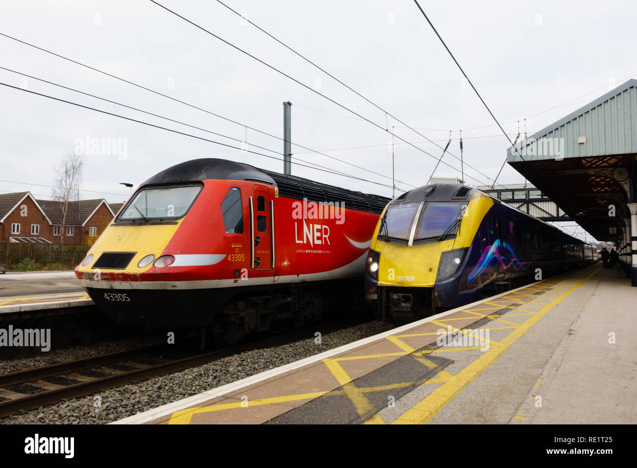 LNER Class 43, 43305, and First Hull Trains, Class 180 Adelante waiting at the platform, Grantham railway station, Lincolnshire, England Stock Photo