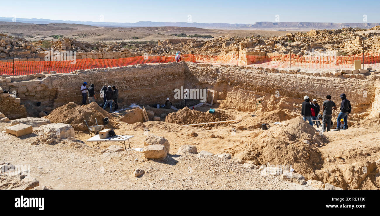 an archaeological dig at shivta national park in israel showing archaeologists and workers excavating the ruins of the water pools Stock Photo