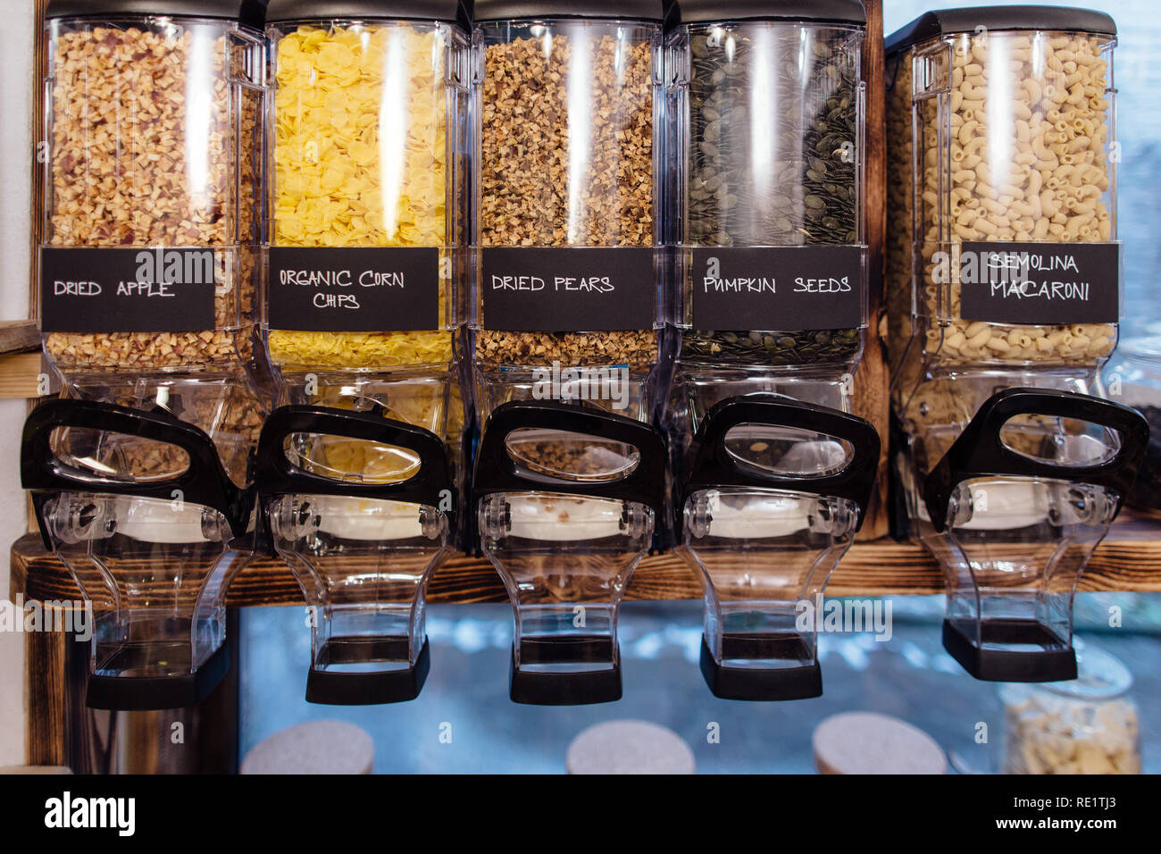 Front view of dried fruit and seeds displayed in grocery store. Shelf