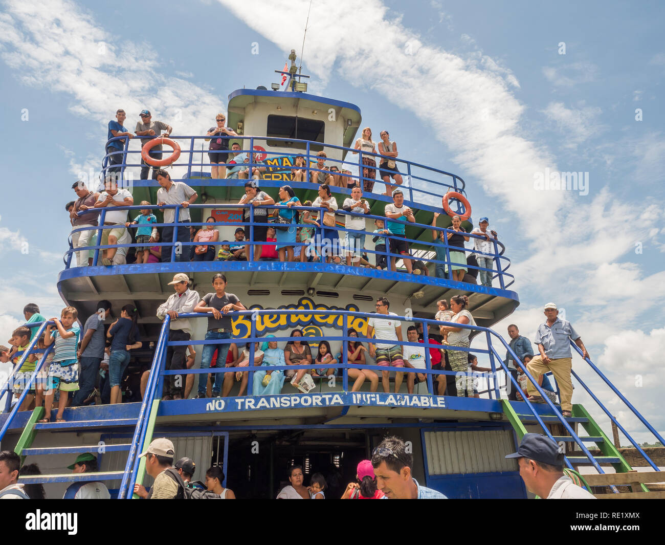 Iquitos, Peru - March 26, 2018: A passengers on  cargo on the Amazon river. Ferry Maria Fernandes Stock Photo