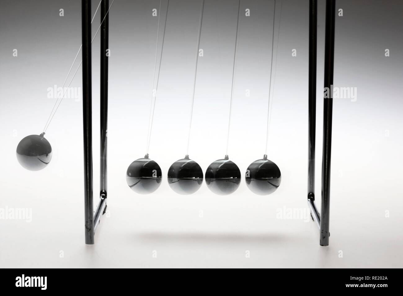 Newton's cradle, ball pendulum Stock Photo Alamy