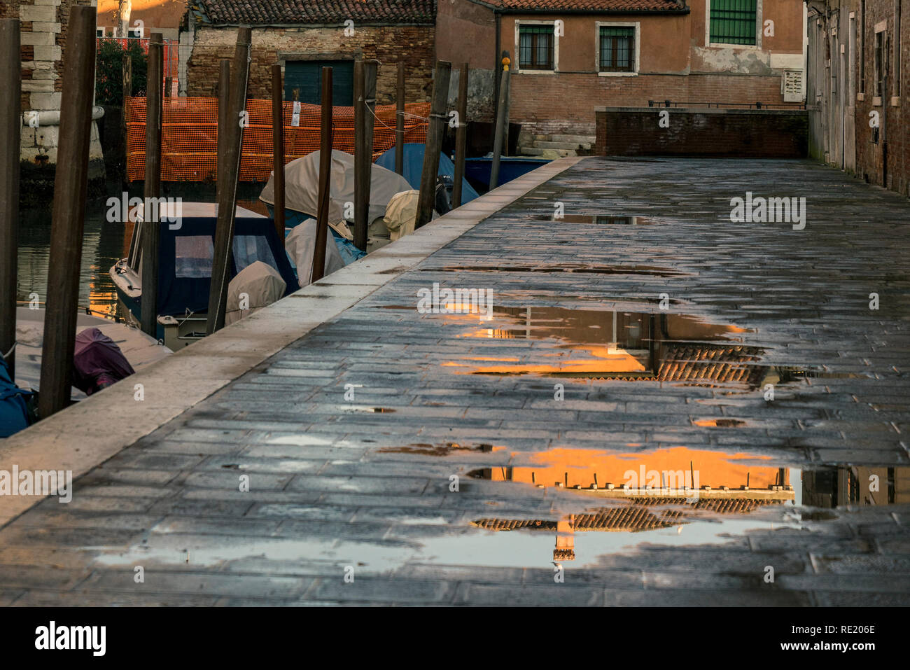 Reflection on puddle in walkway hi-res stock photography and images - Alamy
