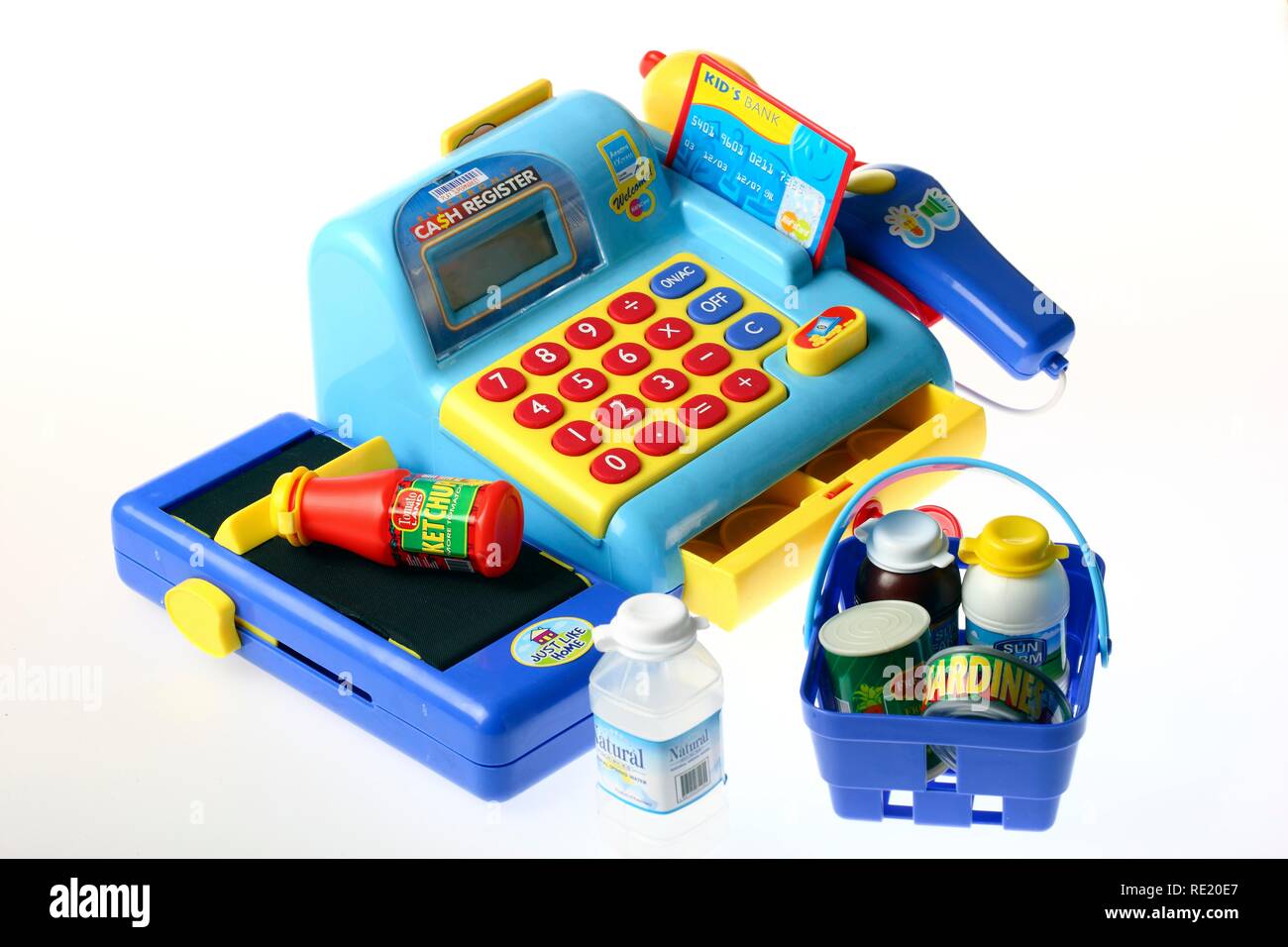 Toy cash register with keyboard, scanner, card reader, treadmill, coins and goods Stock Photo