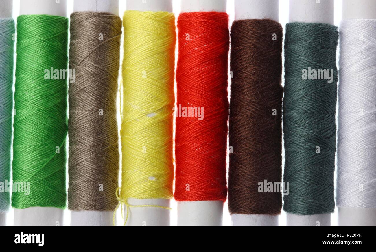 Different coloured sewing cotton reels Stock Photo Alamy