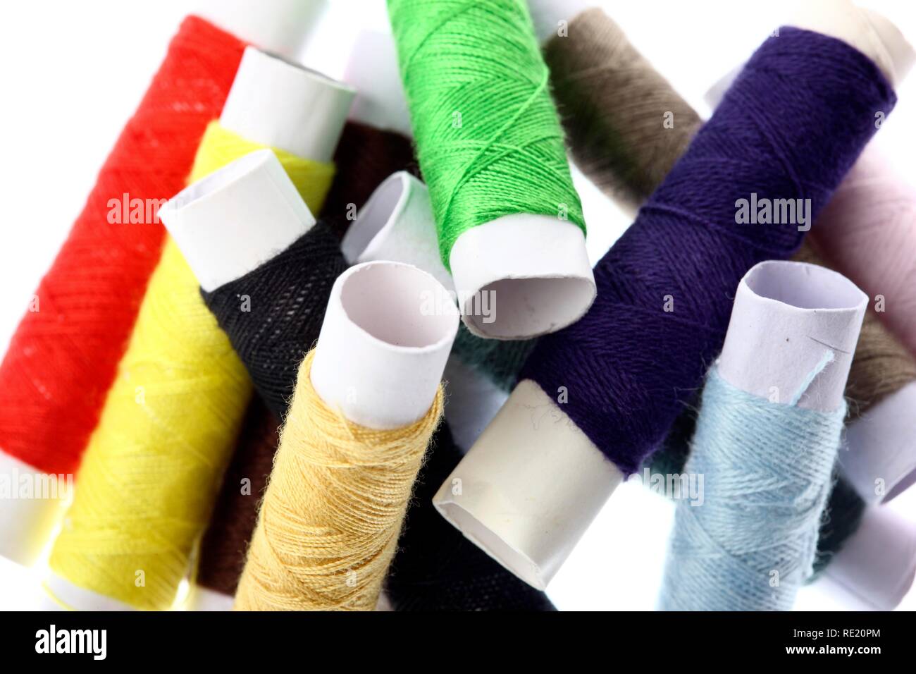 Different coloured sewing cotton reels Stock Photo Alamy