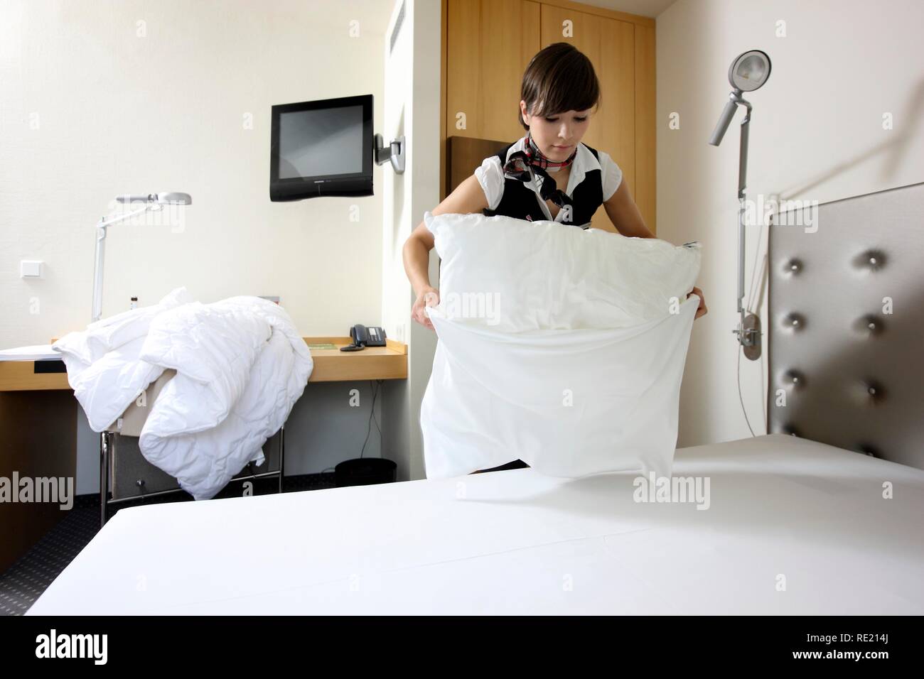 Hotel Management Trainee Working In A Hotel Room Service