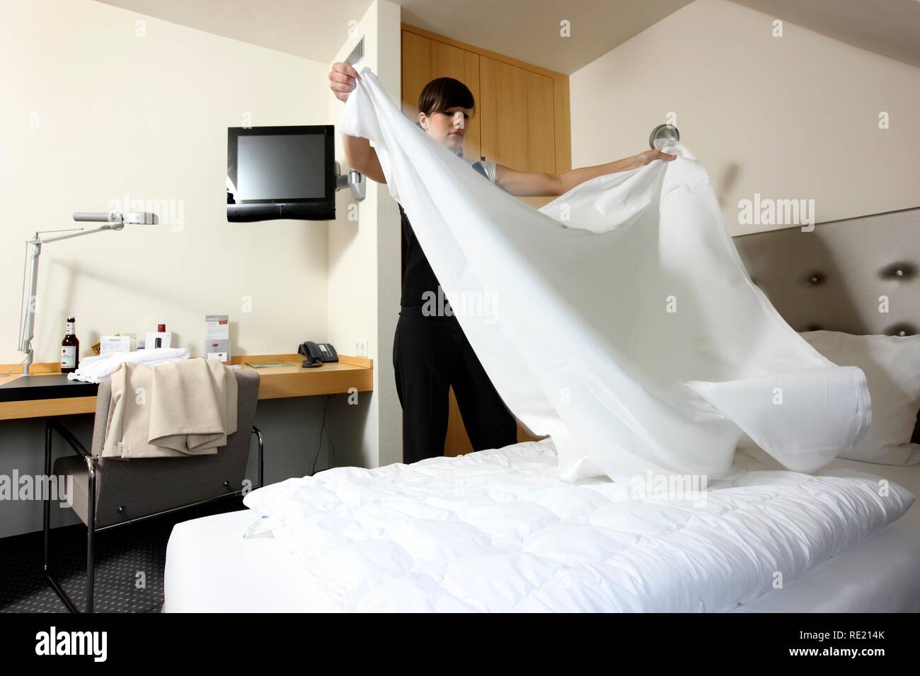 Hotel Management Trainee Working In A Hotel Room Service