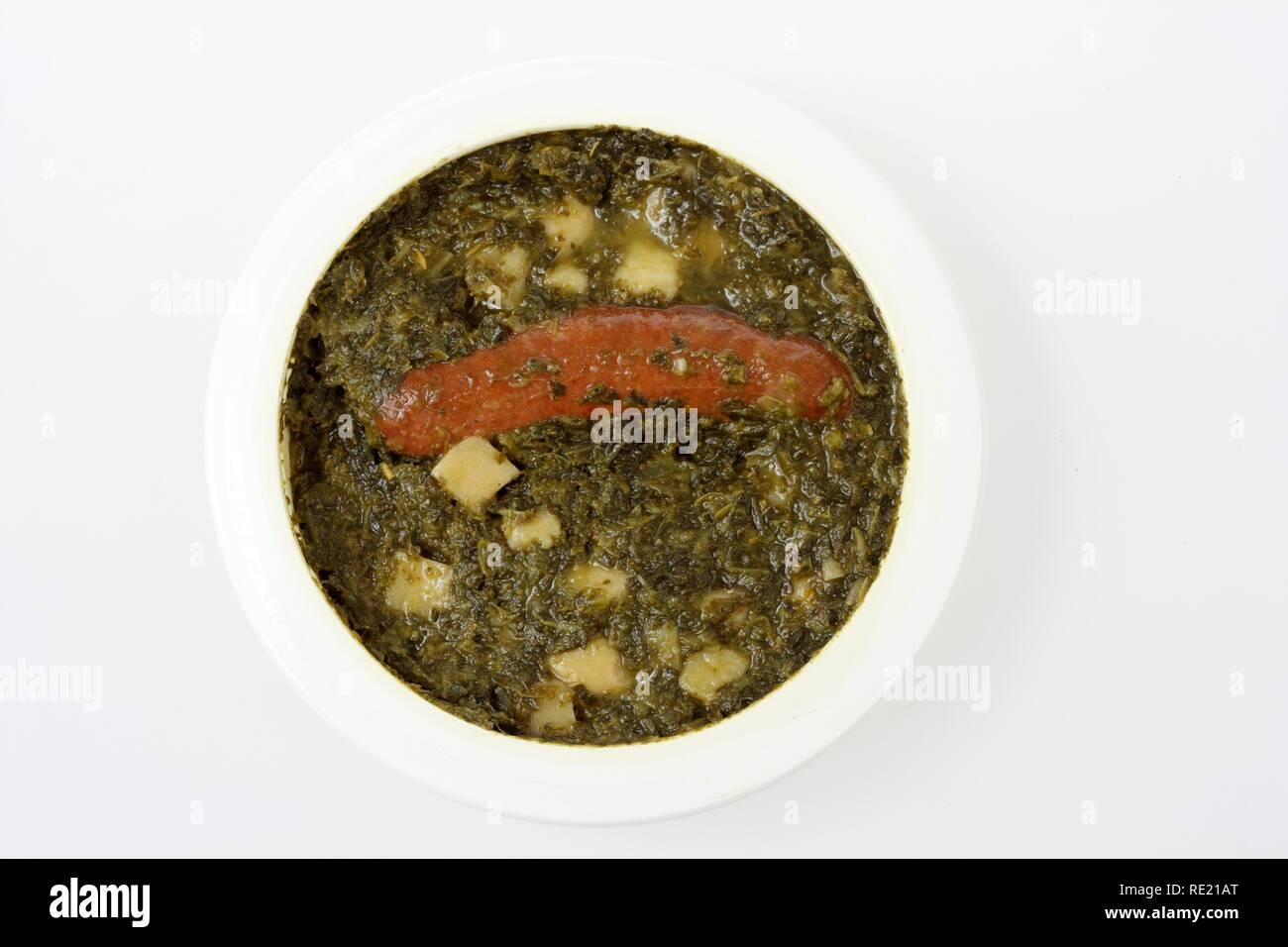 Meal in a plastic container, pre-cooked, portioned for one person, kale with sausage Stock Photo