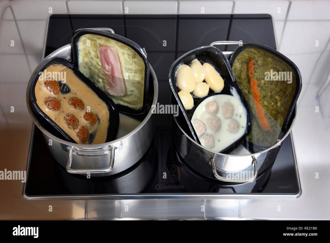 Heating prepared meals in a water bath Stock Photo Alamy
