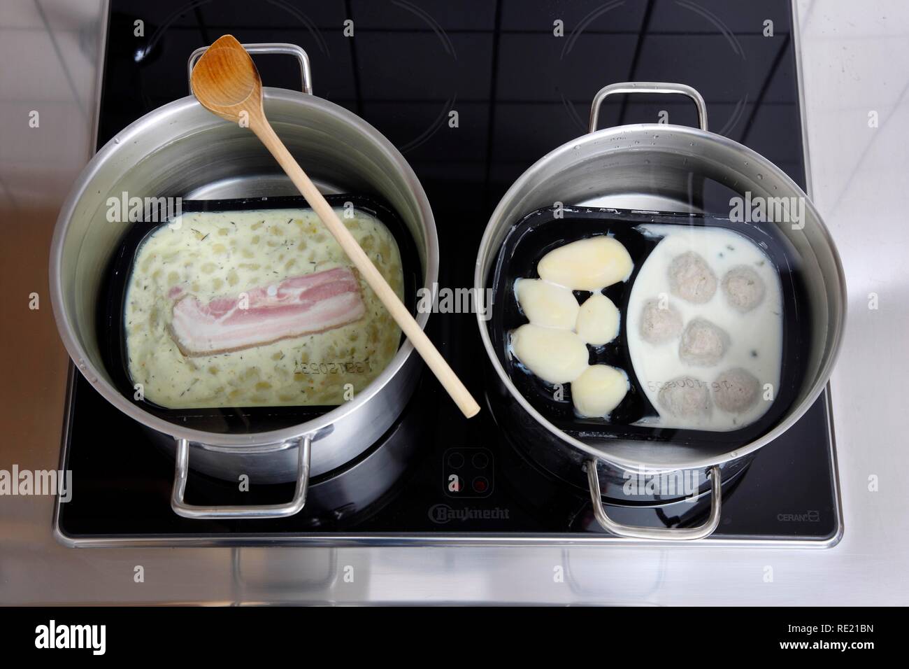Heating prepared meals in a water bath Stock Photo Alamy