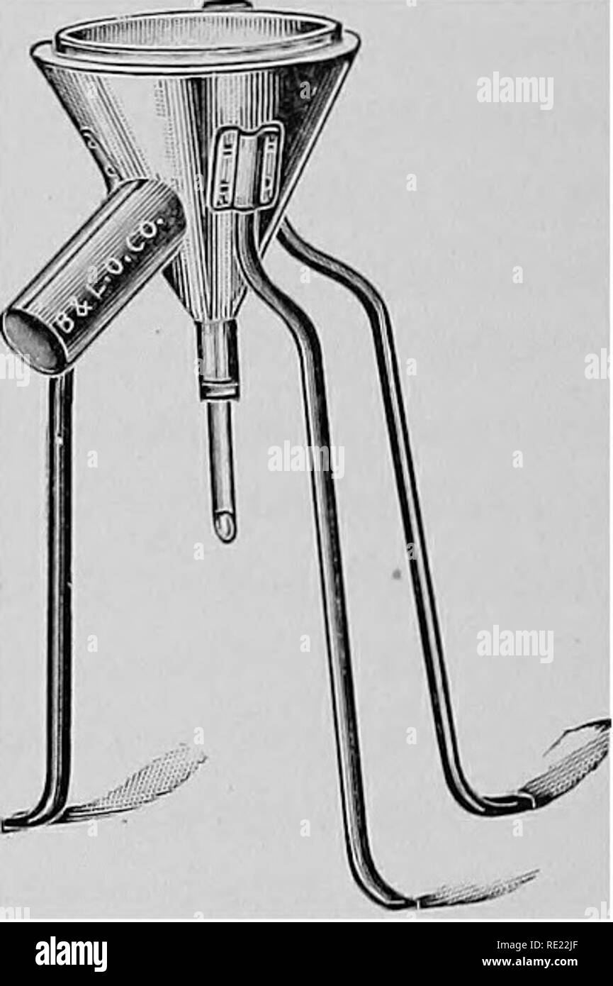 . Pharmaceutical bacteriology, with special reference to disinfection and sterilization. Bacteriology. Fig . 26.—^Hot water funnel with stand and ring gas burner. Fig. 27.—Hot water funnel with stand. tube slant. The swab is returned to the tube, the cotton plug is restored and then returned to the board of health to be destroyed in stove or furnace fire, or destroyed by the attending physician in case there is no board of health to recieve it. Fig. 28.—Glass rods with platinum wire, straight and loop, for inoculating culture tubes, Petri plates, etc.—(WiUiams.) 7. Making Bacterial Cultures. T Stock Photo