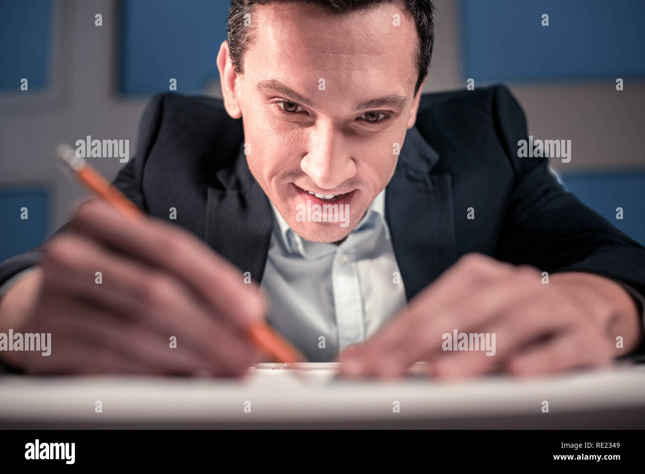 Smart enthusiastic engineer working on the project Stock Photo