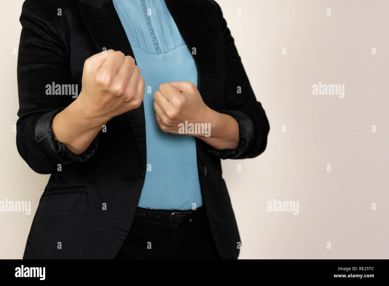 businesswoman in a suit, ready for a fight. Stock Photo