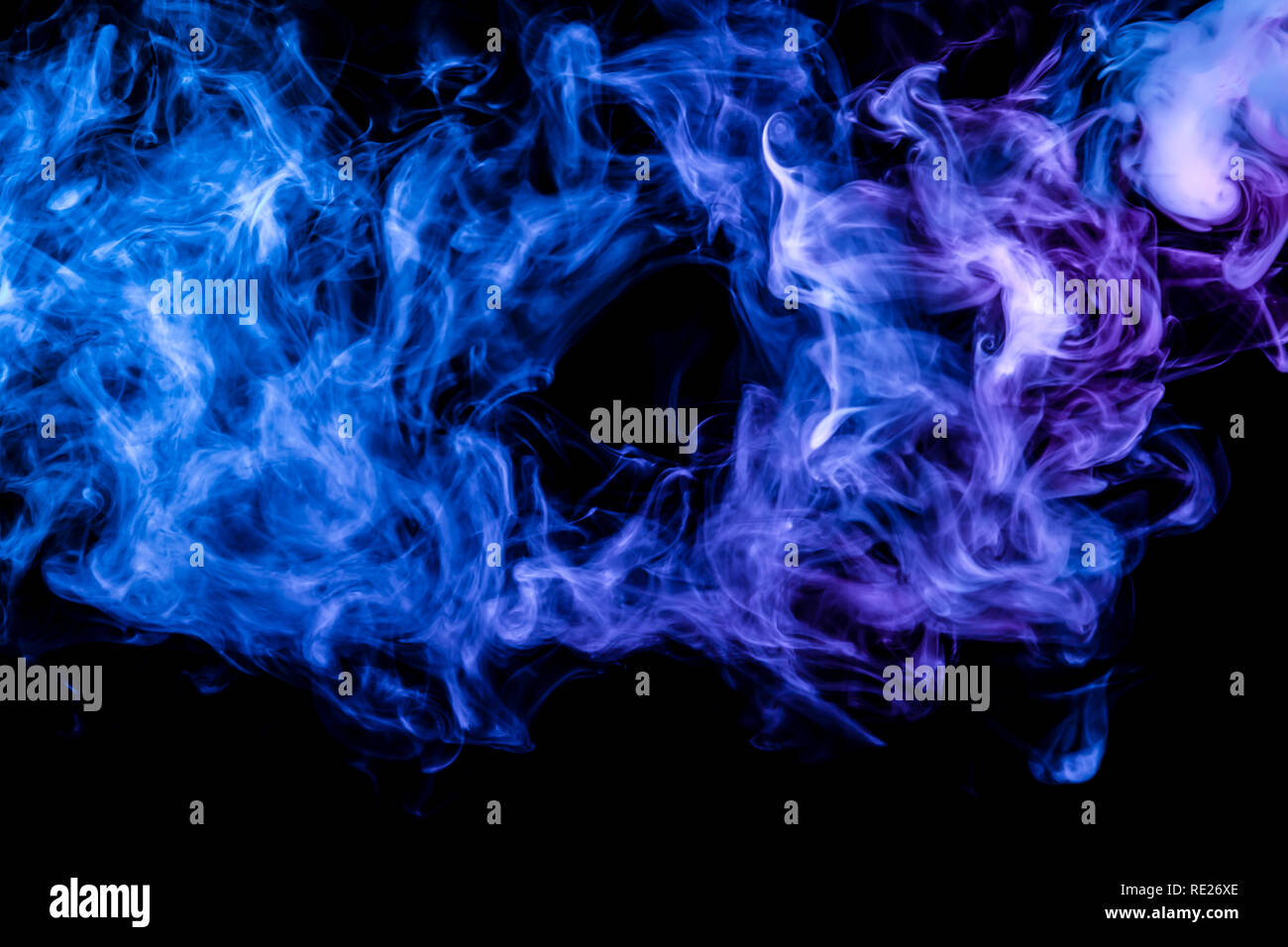 Clubs of colored smoke of blue and pink color on a black isolated background in the form of soft clouds from the vape Stock Photo - Alamy Clubs of colored smoke of blue and pink color on a black isolated background in the form of soft clouds from the vape Stock Photo - Alamy
