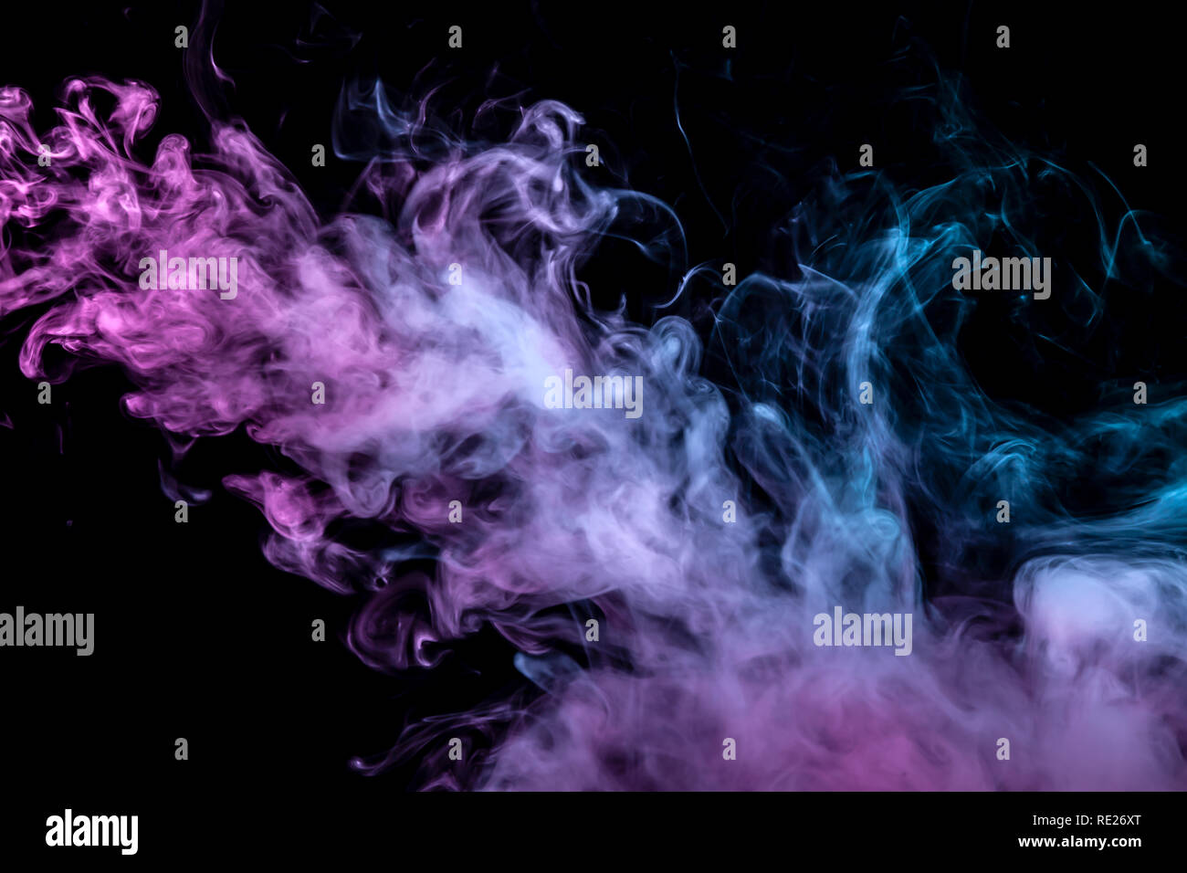 Clubs of colored smoke of blue and pink color on a black isolated background in the form of soft clouds from the vape Stock Photo - Alamy Clubs of colored smoke of blue and pink color on a black isolated background in the form of soft clouds from the vape Stock Photo - Alamy