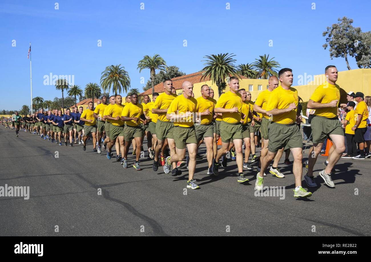Marines with 2nd and 3rd Recruit Training Battalion run in formation behind  the new Marines of Hotel Company, 2nd RTBN, during a motivational run at  Marine Corps Recruit Depot San Diego, Nov.