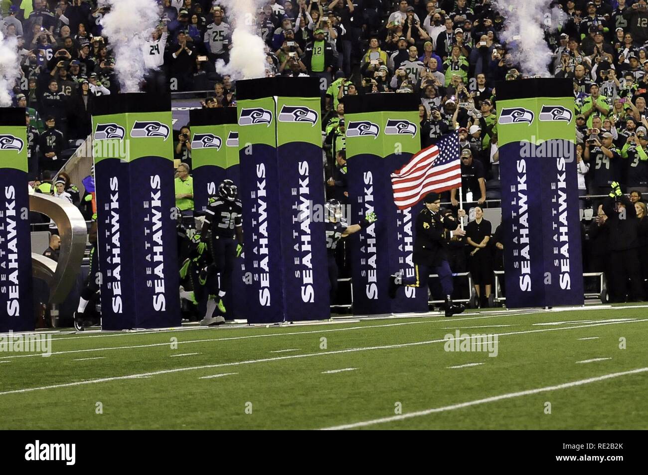 Staff Sgt. John McLaughlin leads the Seattle Seahawks onto the field
