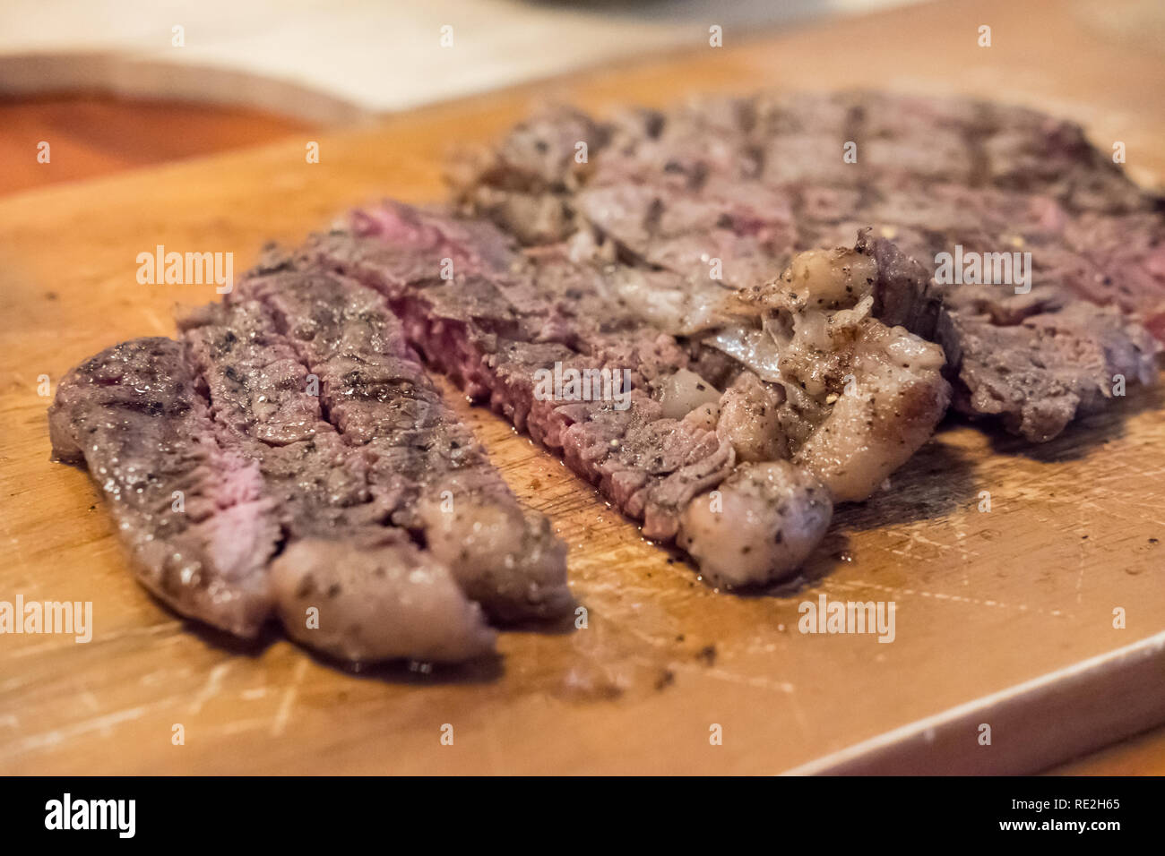 Medium rare meat on plate with sauce Stock Photo