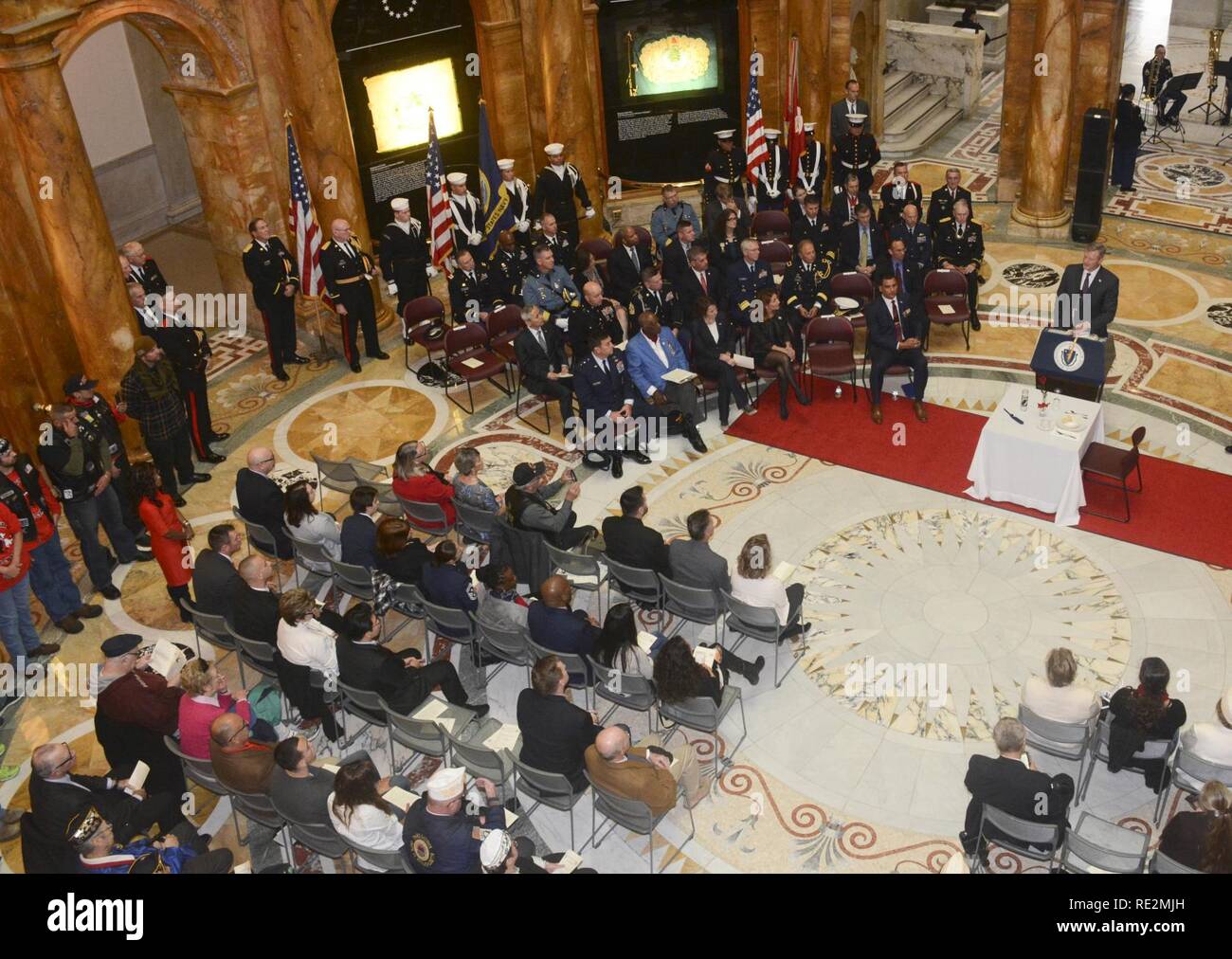 BOSTON (Nov. 11, 2016) Governor of Massachusetts, Charlie Baker, addresses Veterans during a Veterans' day ceremony at the Massachusetts State House. The crew of USS Constitution participated in various events hosted by The Commonwealth of Massachusetts to honor those who have served in the armed forces of the United States of America. Stock Photo