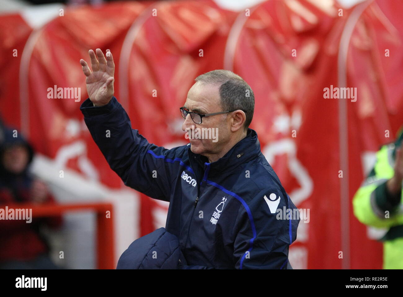 Nottingham, Nottinghamshire, UK. 19th January, 2018. Martin O'Neill greets the crowd and takes his place in the Forest dugout as he takes charge of Nottingham Forest for the first time since his appointment as manager. Credit: Simon Newbury/Alamy Live News Stock Photo