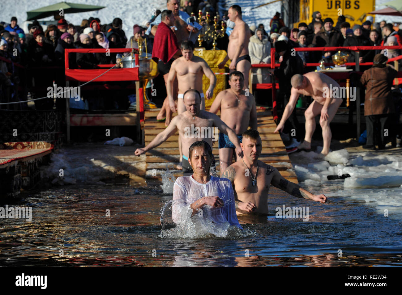 Kiev, Ukraine. 19th Jan 2019. People seen plunging into ice water of the Dnieper river during the Orthodox Epiphany next to St. Pokrov's church. Credit: SOPA Images Limited/Alamy Live News Stock Photo
