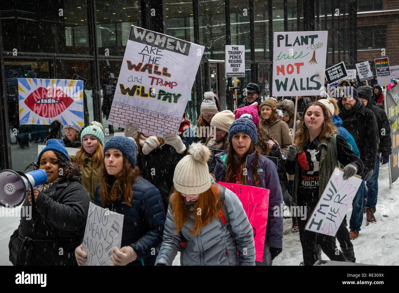 Chicago, USA. 19th Jan 2019. In the face of a fierce winter snowstorm, Chicago’s “Young Women’s March” brought a small but spirited crowd to Federal Plaza on January 19th to proclaim the power of women and display their rejection of President Donald Trump and his policies. Assembling at 10 am on a snowy Saturday, the group made impassioned speeches about issues facing young women today, and then marched around the plaza carrying mostly homemade signs and chanting resistance to the current administration. Credit: Matthew Kaplan/Alamy Live News Stock Photo