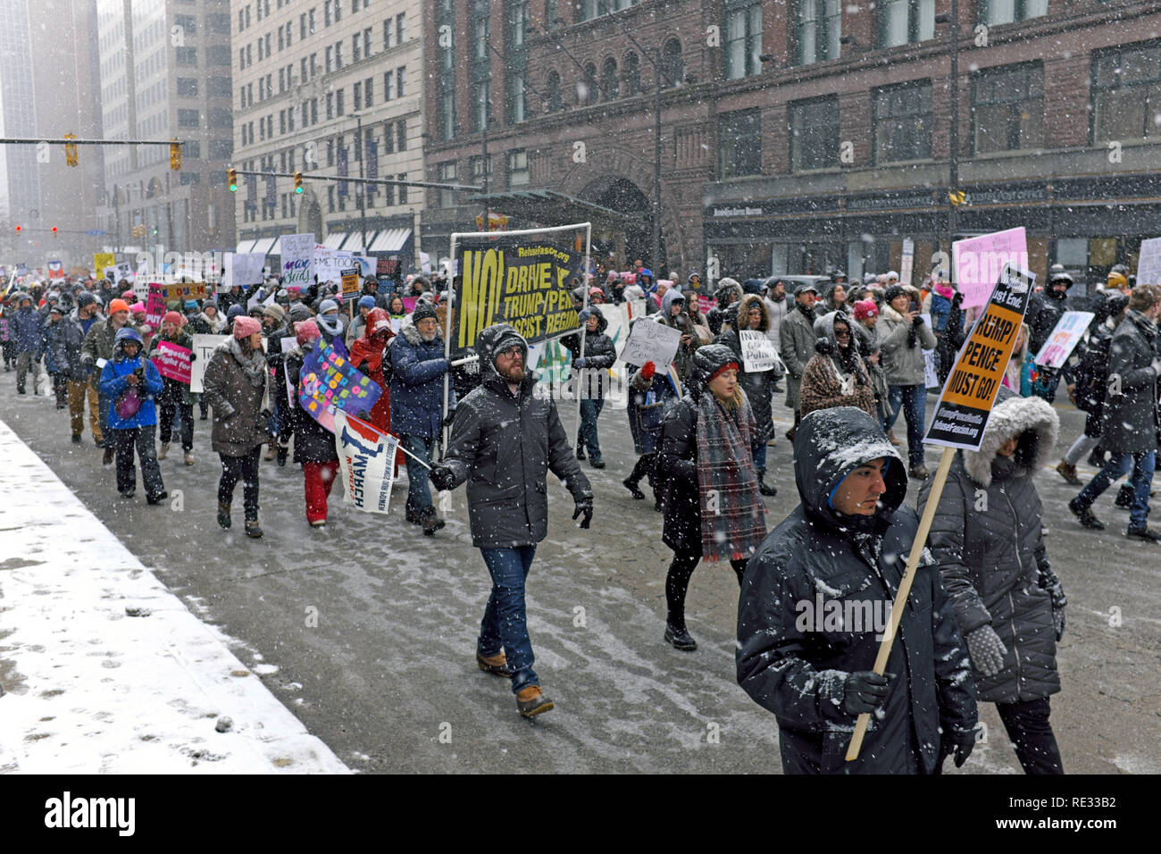 Cleveland, Ohio, USA, 19th January, 2019.  Participants in the 2019 Women's March in downtown Cleveland, Ohio, USA make their way down Superior Avenue during the first major winter storm of the season.  Credit: Mark Kanning/Alamy Live News. Stock Photo