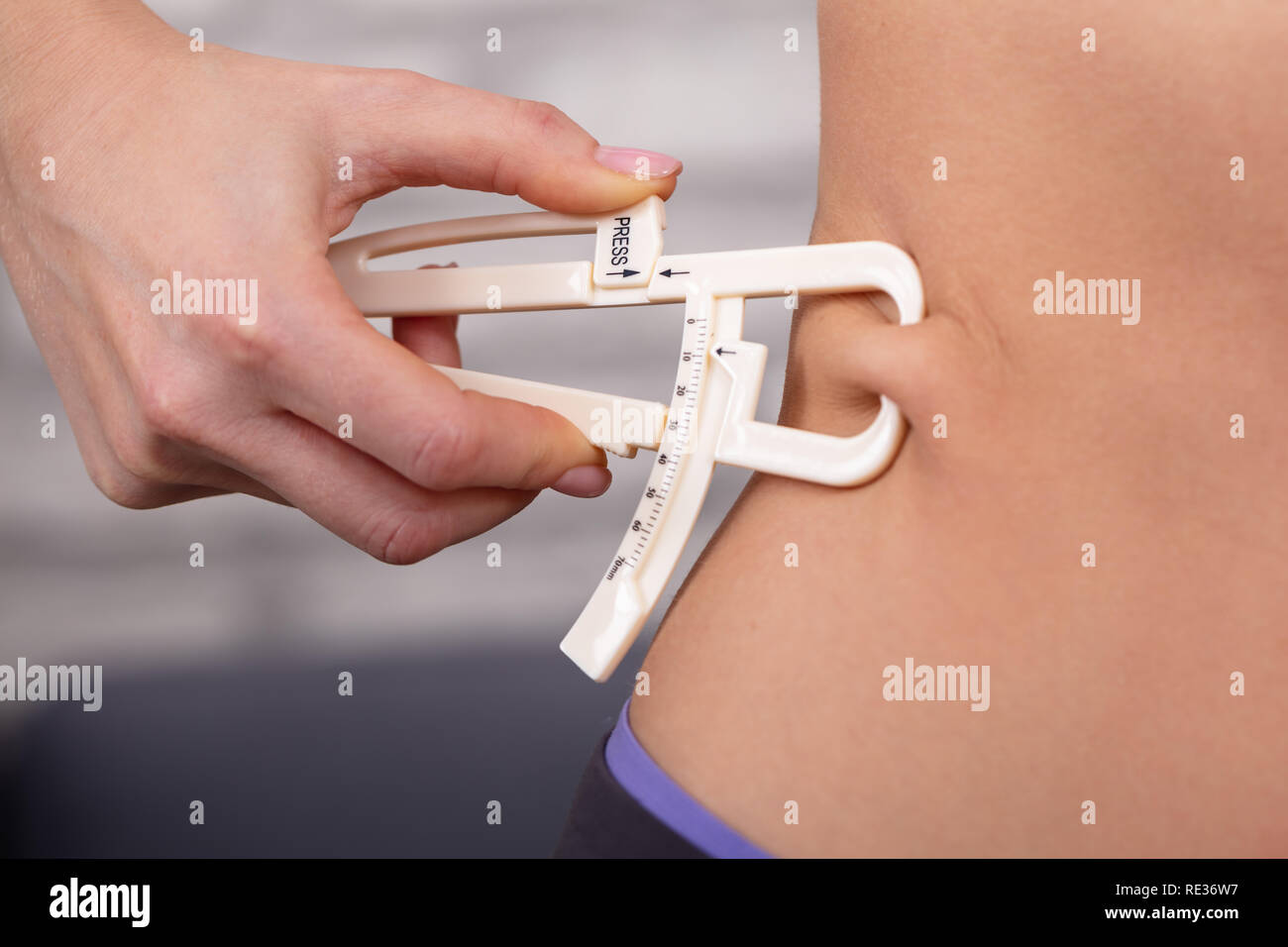Body Fat Calipers Stock Photo - Download Image Now - Caliper, Overweight,  Black Background - iStock